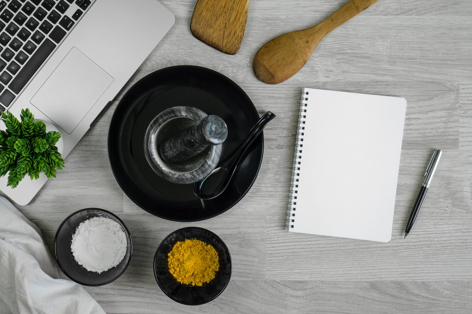 Studio kitchen workspace with plated dishes and notes
